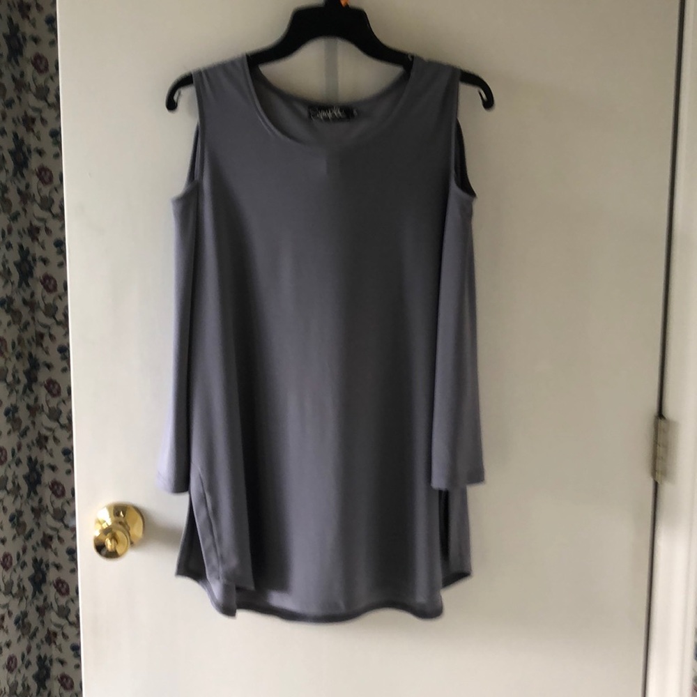 Sleeveless tunic with cut out sleeves